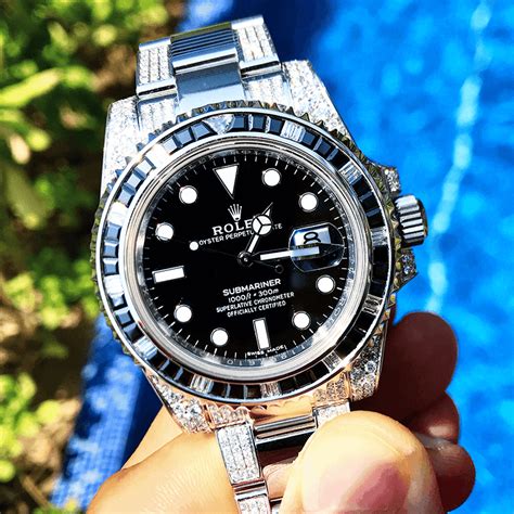 rolex submariner with diamond bezel.